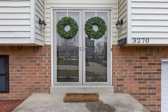 property entrance with brick siding