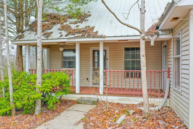 property entrance with metal roof and a porch