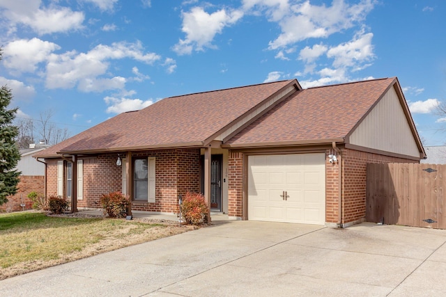 single story home with brick siding, a shingled roof, concrete driveway, fence, and a garage