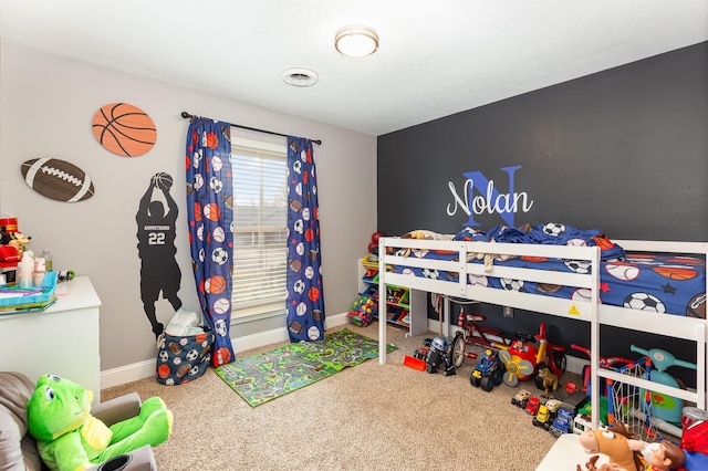 bedroom featuring carpet floors and baseboards