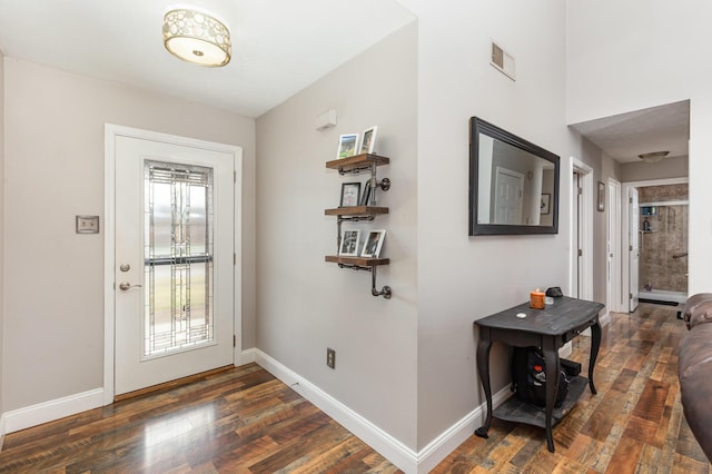 doorway with a healthy amount of sunlight, visible vents, and baseboards