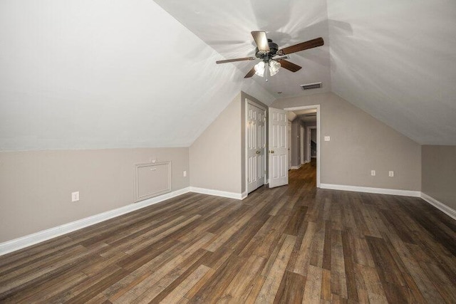 bonus room featuring lofted ceiling, wood finished floors, visible vents, and baseboards