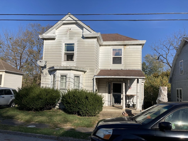 view of front of house with a shingled roof