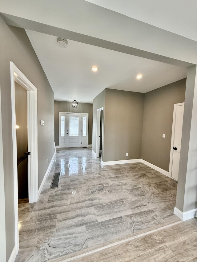 entrance foyer featuring visible vents and baseboards