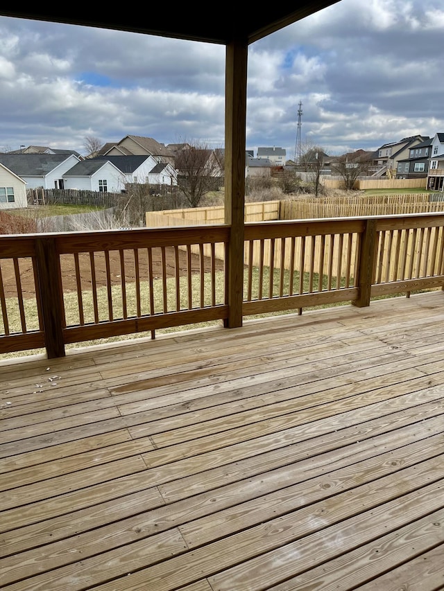 wooden deck with fence and a residential view