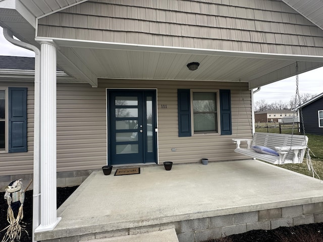 entrance to property with a porch