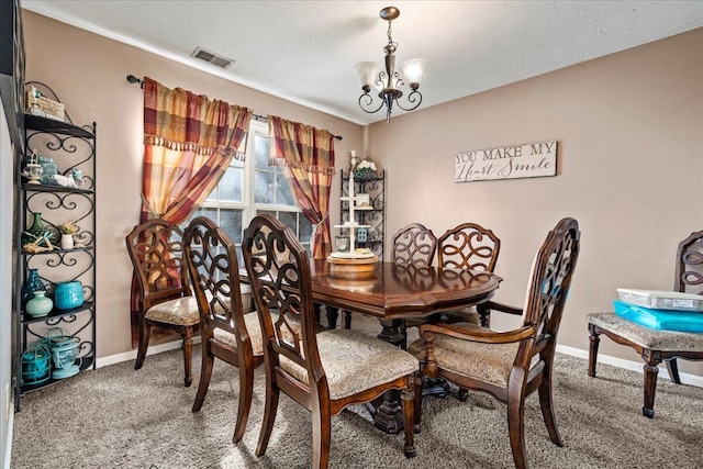 dining room featuring an inviting chandelier, carpet, visible vents, and baseboards