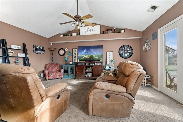 living room with lofted ceiling, carpet, visible vents, and ceiling fan