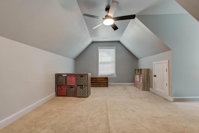 bonus room with vaulted ceiling, a ceiling fan, baseboards, and carpet floors