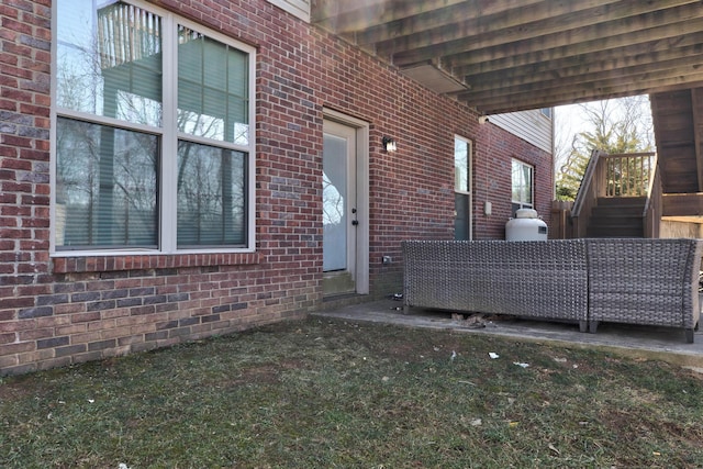 doorway to property with brick siding