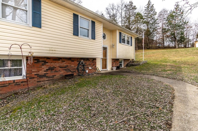 view of home's exterior with a lawn