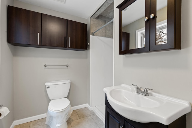 full bathroom featuring tile patterned floors, toilet, vanity, and baseboards