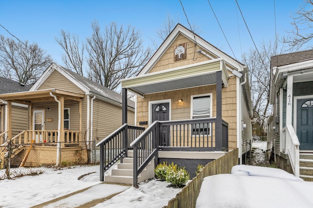 shotgun-style home featuring a porch