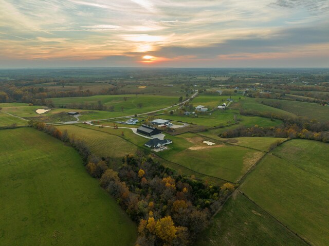 birds eye view of property with a rural view