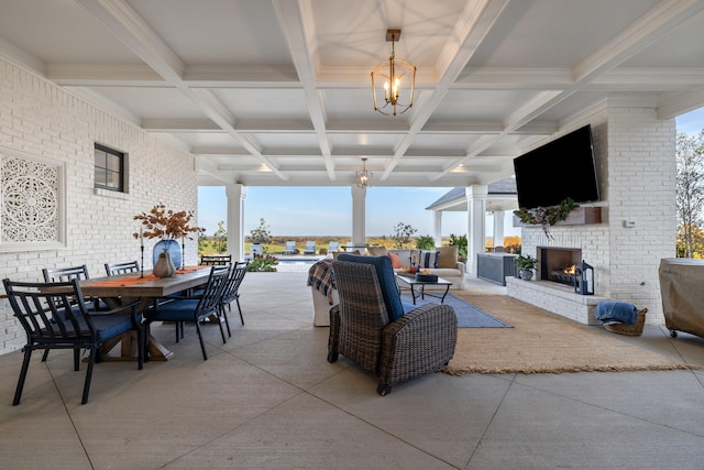 interior space with an outdoor brick fireplace and outdoor dining area