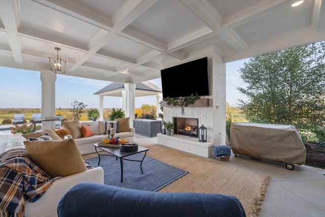 view of patio / terrace with an outdoor living space with a fireplace and grilling area