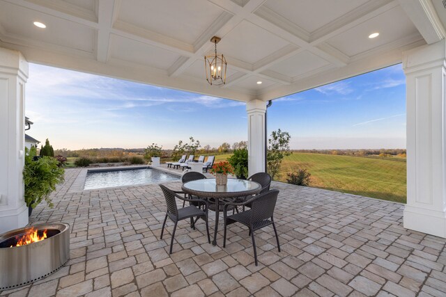 view of patio / terrace featuring an outdoor pool and outdoor dining space