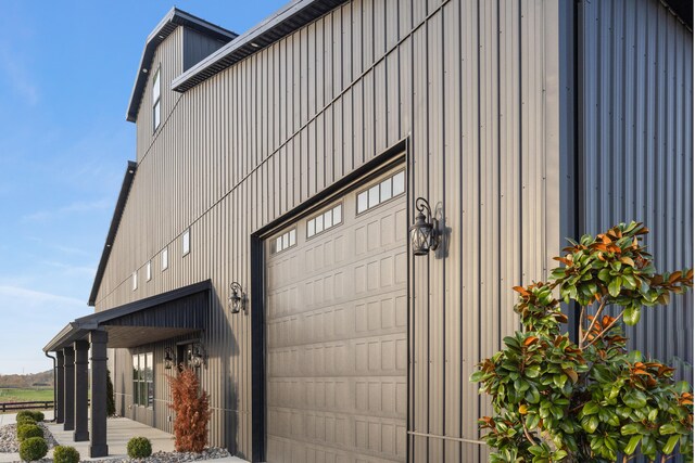 view of side of home featuring an outbuilding