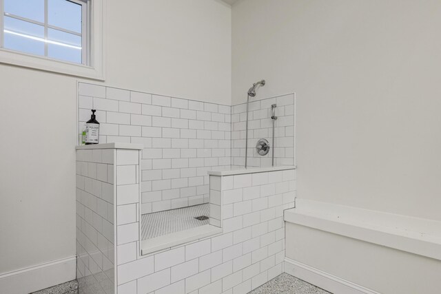 full bath featuring tiled shower