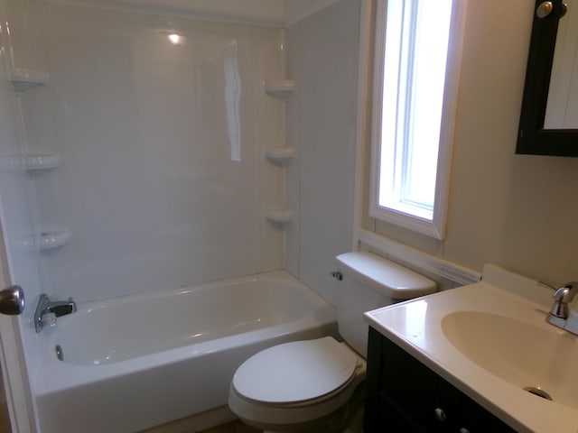 bathroom with vanity, toilet, and shower / bathtub combination