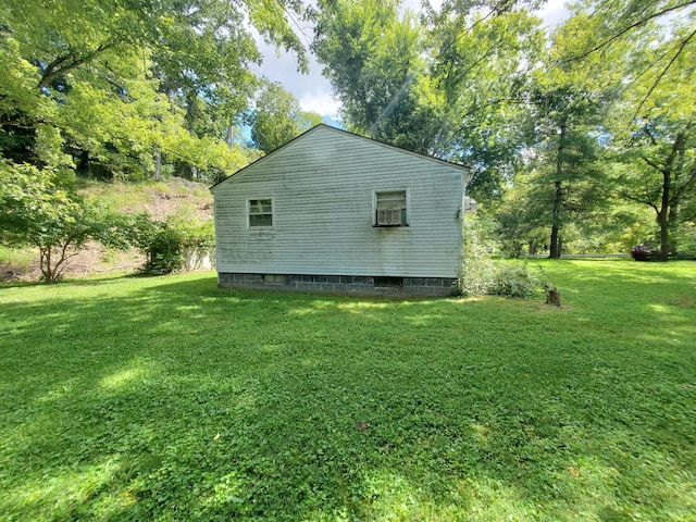 view of home's exterior with a yard