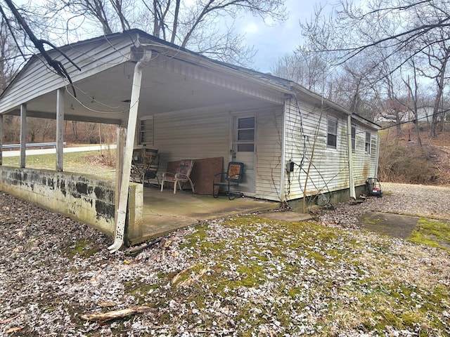 exterior space with a carport