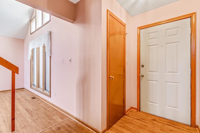 interior space featuring light wood-style floors and baseboards