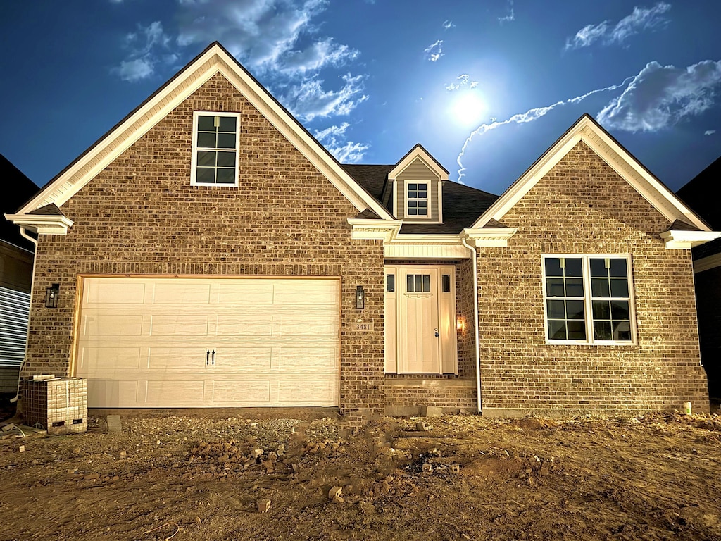 view of front of home featuring brick siding