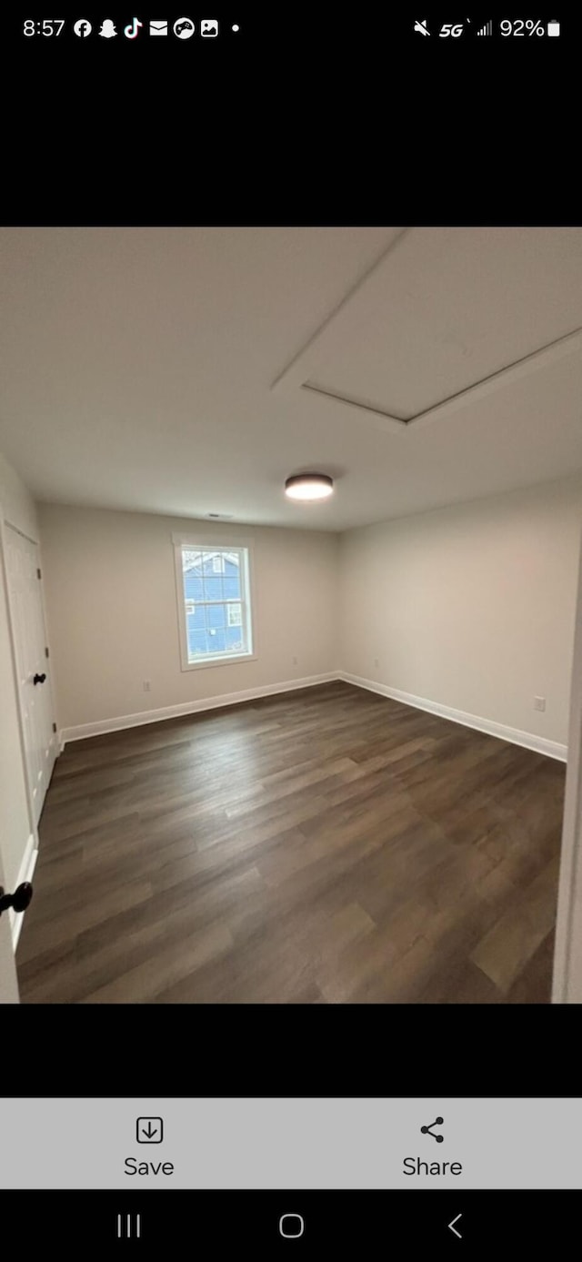 below grade area with baseboards and wood finished floors