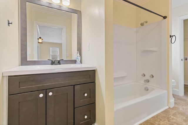 full bath with tile patterned flooring, bathtub / shower combination, toilet, vanity, and ornamental molding