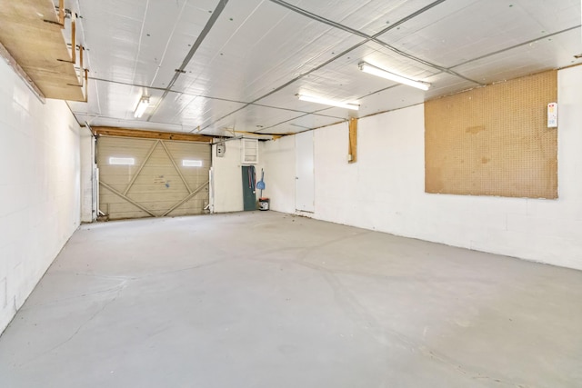 garage with concrete block wall