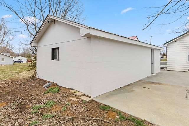 view of side of home featuring a patio