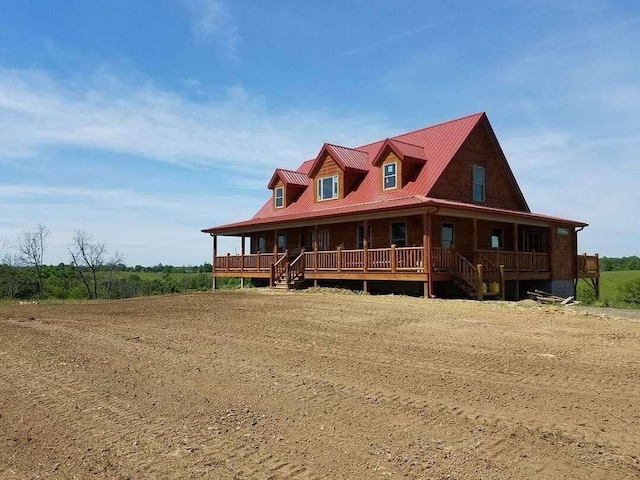 view of front of home with metal roof and covered porch