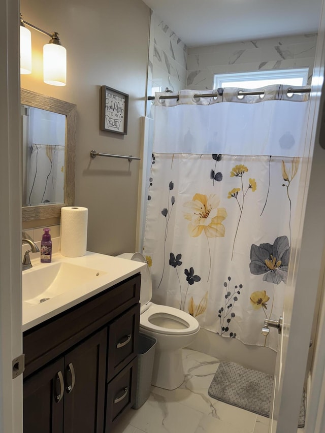 bathroom with shower / bath combo, marble finish floor, vanity, and toilet