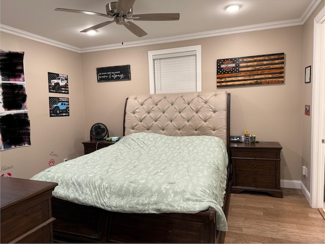 bedroom featuring light wood-style flooring, baseboards, ceiling fan, and crown molding