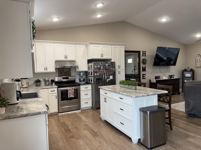 kitchen with lofted ceiling, under cabinet range hood, fridge with ice dispenser, stainless steel range with electric stovetop, and a sink