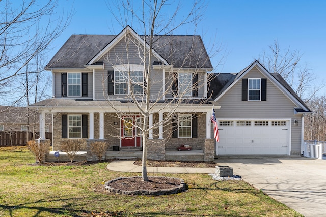 craftsman-style house featuring covered porch, concrete driveway, a front yard, and fence