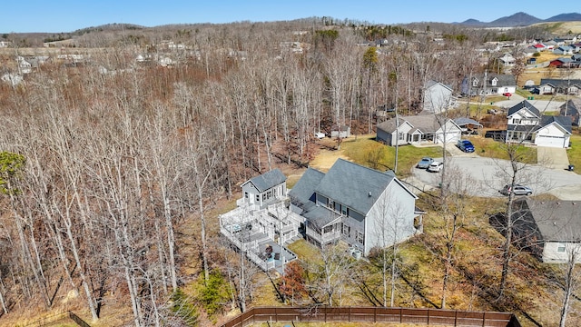 bird's eye view featuring a forest view and a residential view