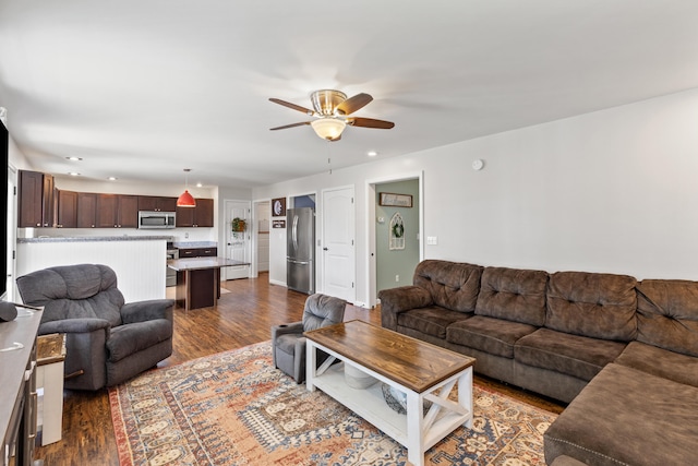 living room featuring ceiling fan, wood finished floors, and recessed lighting