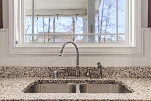 details with a sink and light stone counters