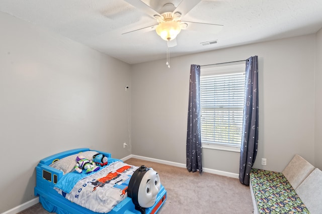 bedroom featuring visible vents, baseboards, and carpet