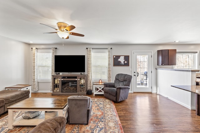 living room featuring recessed lighting, wood finished floors, baseboards, and ceiling fan