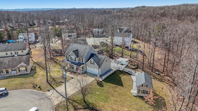 drone / aerial view with a view of trees