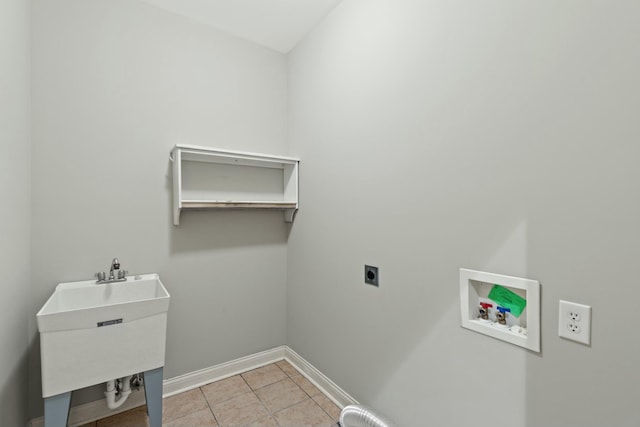 clothes washing area with laundry area, light tile patterned floors, baseboards, hookup for a washing machine, and electric dryer hookup