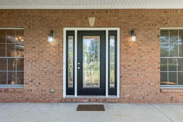 property entrance with brick siding