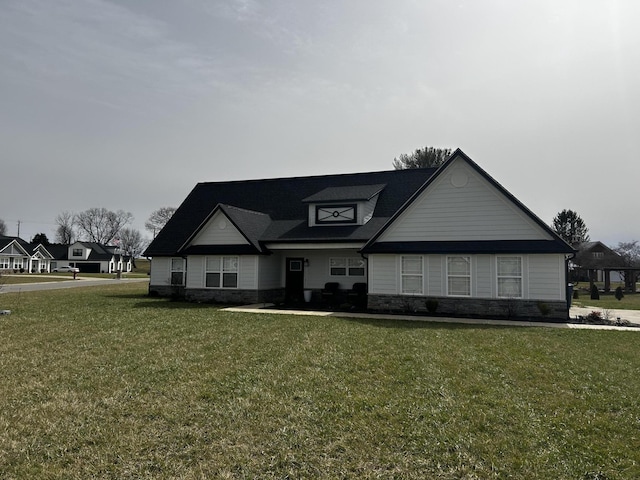 view of front facade with stone siding and a front lawn