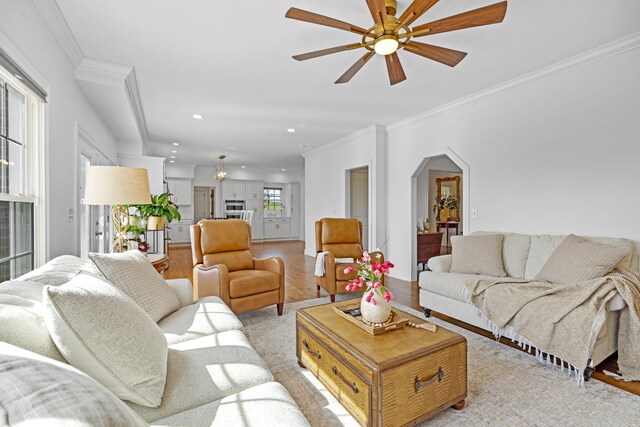 1775 Irvine Rd, Winchester, KY 40391 - living area featuring a ceiling fan, wood finished floors, crown molding, a fireplace, and baseboards