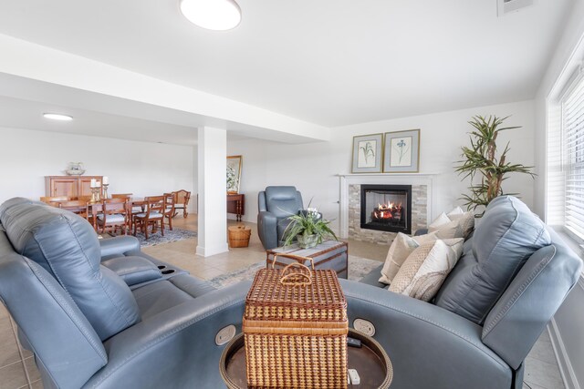 1775 Irvine Rd, Winchester, KY 40391 - living room with light tile patterned floors, a fireplace, and baseboards