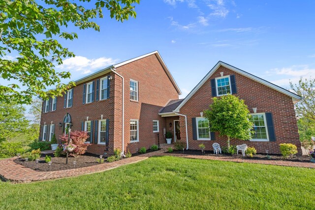 1775 Irvine Rd, Winchester, KY 40391 - laundry room with washing machine and clothes dryer, light tile patterned floors, and baseboards