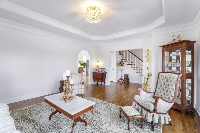 1775 Irvine Rd, Winchester, KY 40391 - living area featuring healthy amount of natural light, a raised ceiling, wood finished floors, stairway, and crown molding